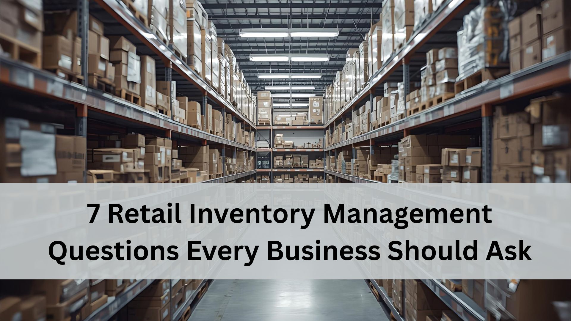 A storage with tall metal racks filled with cardboard boxes and inventory on both sides of a long aisle.