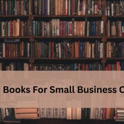 Bookshelf filled with rows of books with a soft beige banner across the center displaying the text 'Top 10 Books For Small Business Owners