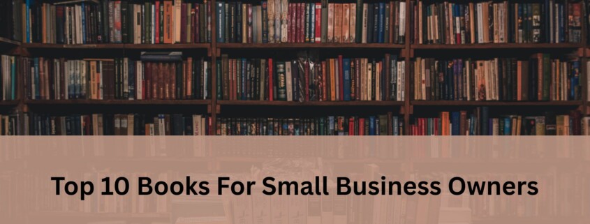 Bookshelf filled with rows of books with a soft beige banner across the center displaying the text 'Top 10 Books For Small Business Owners