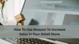 A small cardboard Amazon figure stands on a laptop keyboard in front of an open webpage, with text about using Amazon to increase retail store sales.