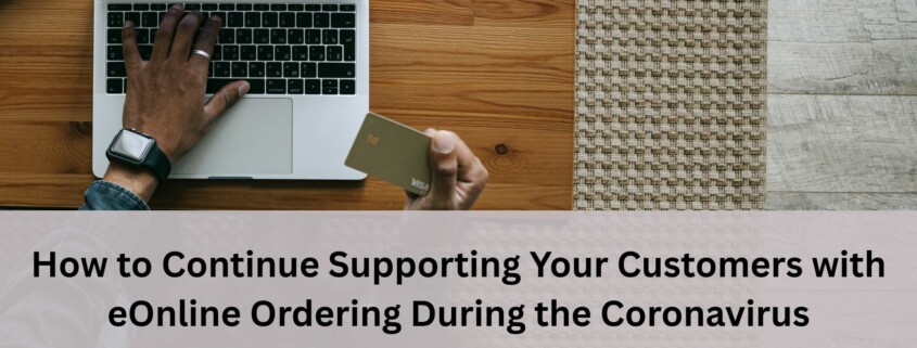 Person using a laptop while holding a credit card, representing online ordering and remote customer support during the coronavirus pandemic.