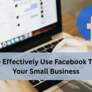 Person typing on a laptop with Facebook on the screen.