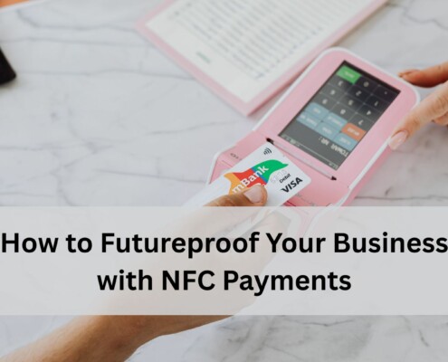 A customer taps a contactless card on a pink NFC payment terminal while another person points at the device screen