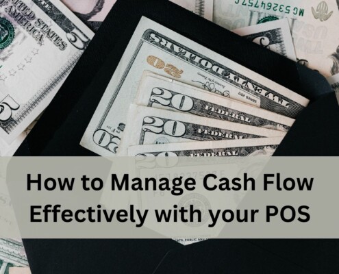 An open black envelope filled with US dollar bills, including twenties, tens, and fives, spread out on top of a larger pile of cash