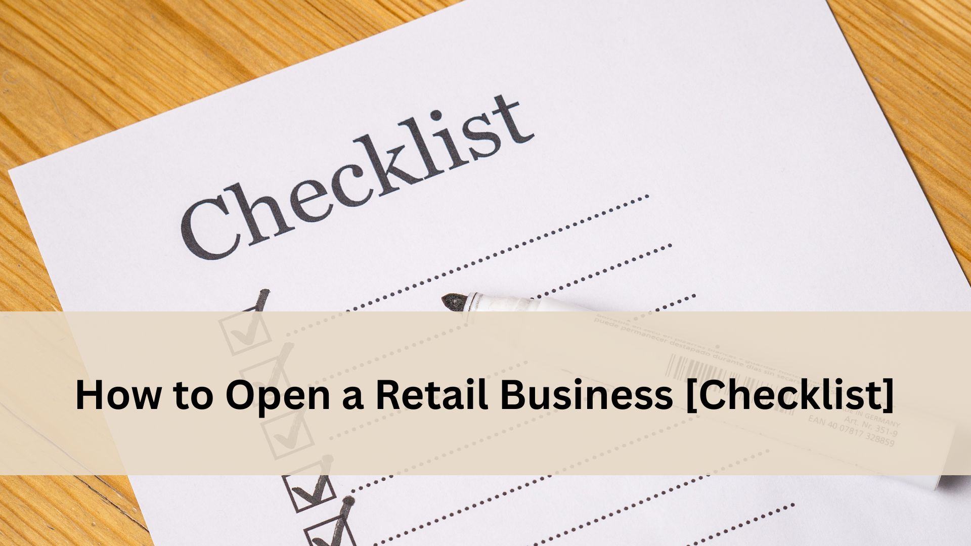 Close up of a retail business checklist form on a wooden table with a pen placed on top