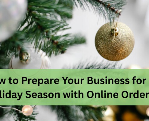 A close up of a decorated Christmas tree with green branches and shiny ornaments, including a gold glittery bauble in focus