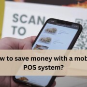 Hand holding a smartphone showing a mobile POS menu with food items, with a QR code sign in the background and the text “How to save money with a mobile POS system?”