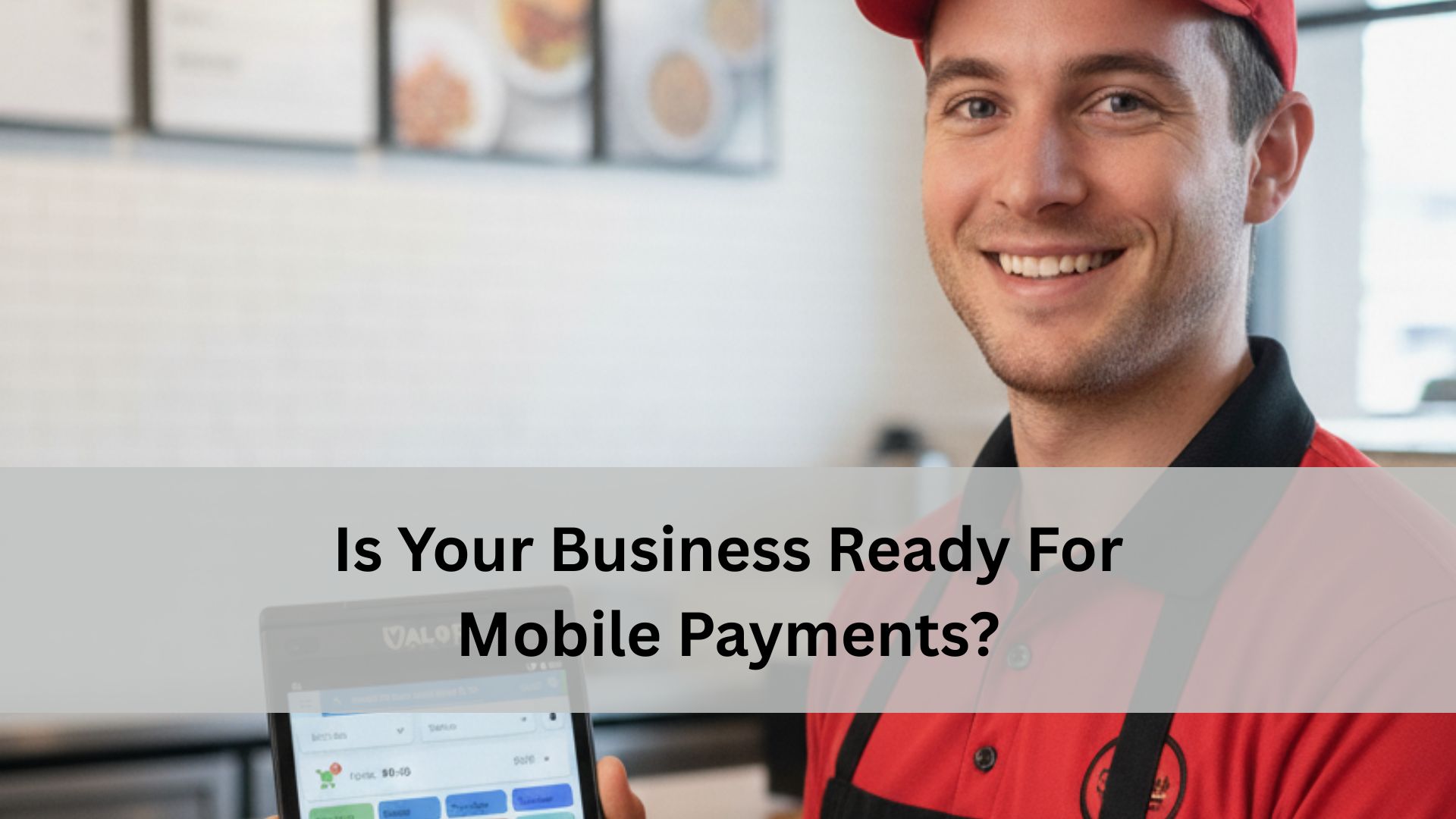 Smiling employee in a red uniform holding a mobile POS device inside a restaurant