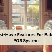 A cozy bakery interior with two curved display cases filled with pastries.