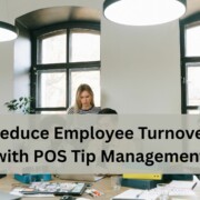 A team working together in a bright office with large arched windows.