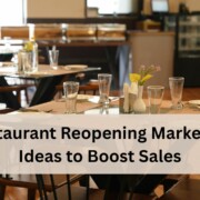 A clean and modern restaurant dining area with neatly arranged tables set with glasses, plates, and cutlery.