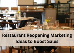 A clean and modern restaurant dining area with neatly arranged tables set with glasses, plates, and cutlery.