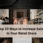 A stylish retail clothing store with racks of neatly arranged clothes and modern lighting