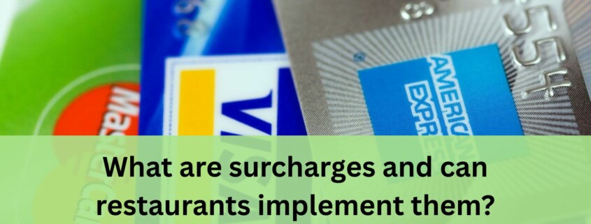 A close up view of several credit cards layered on top of each other, including MasterCard, Visa, and American Express.