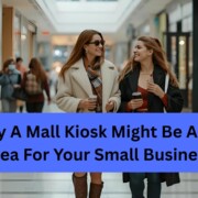 2 woman are walking inside mall